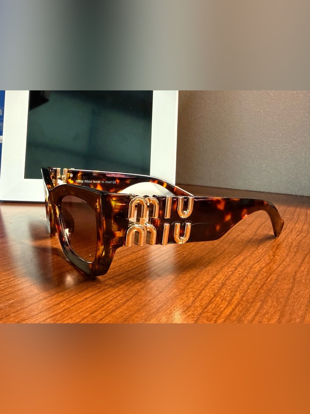 Miu Miu Tortoiseshell Sunglasses with Gold Logo Hardware
